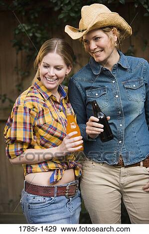 Country mother and daughter standing together View Large Photo Image Stock Photo - Country mother and daughter standing together. Fotosearch