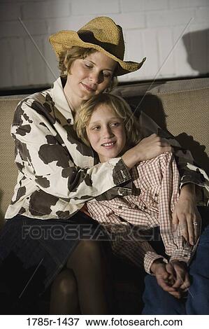 Country mother embracing son View Large Photo Image Stock Photo - Country mother embracing son. Fotosearch
