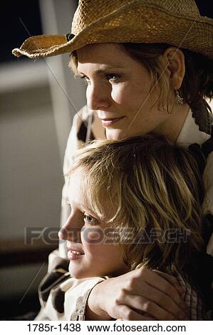 Stock Photo - Country mother embracing son. Fotosearch
