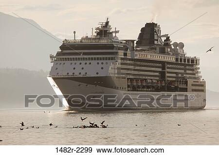 Stock Photo - Cruise ship in a channel, Johnstone Strait, British Columbia, Canada. Fotosearch