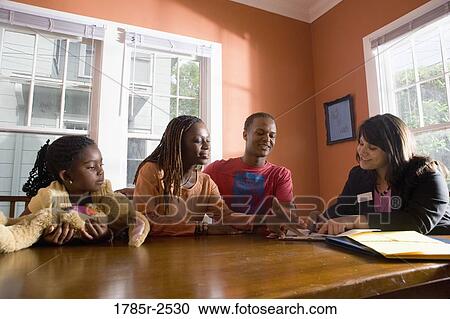 Family at home signing papers with agent View Large Photo Image Stock Image - Family at home signing papers with agent. Fotosearch