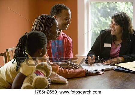 Family at home signing papers with agent View Large Photo Image Stock Image - Family at home signing papers with agent. Fotosearch