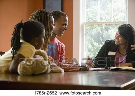 Family at home signing papers with agent View Large Photo Image Stock Image - Family at home signing papers with agent. Fotosearch