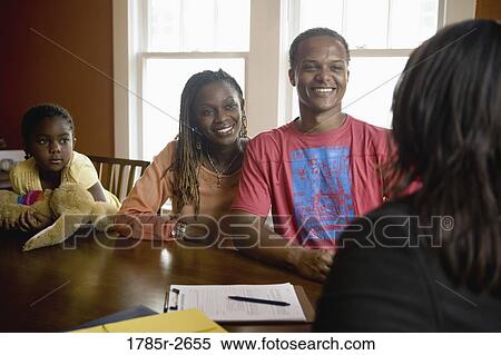 Family at home signing papers with agent View Large Photo Image Stock Photography - Family at home signing papers with agent. Fotosearch