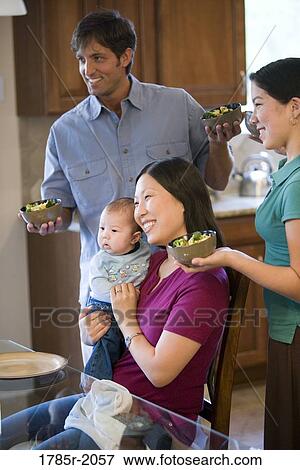 Family eating in kitchen View Large Photo Image Stock Photo - Family eating in kitchen. Fotosearch