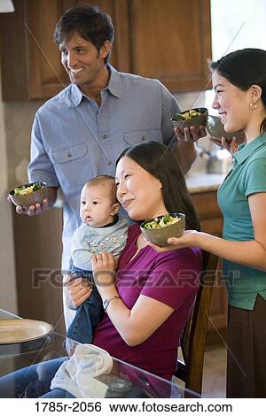 Family eating in kitchen View Large Photo Image Stock Photograph - Family eating in kitchen. Fotosearch