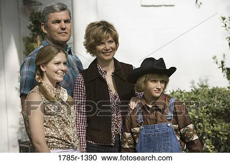 Family in country clothes standing together View Large Photo Image Stock Image - Family in country clothes standing together. Fotosearch