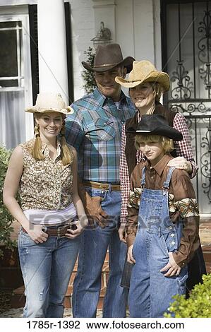 Family in country clothes standing together View Large Photo Image Stock Image - Family in country clothes standing together. Fotosearch