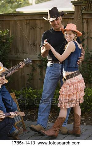 Family playing country music and dancing View Large Photo Image Stock Image - Family playing country music and dancing. Fotosearch