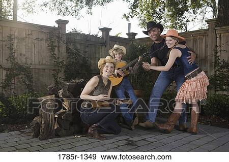 Stock Photo - Family playing country music and dancing together. Fotosearch