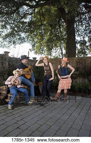 Stock Photography - Family playing country music and dancing together. Fotosearch
