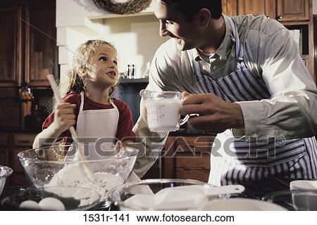 Father and daughter baking together View Large Photo Image Stock Image - Father and daughter baking together. Fotosearch