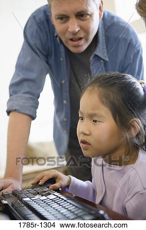 Father and daughter working on computer View Large Photo Image Picture - Father and daughter working on computer. Fotosearch
