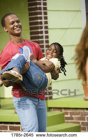 Father carrying daughter outside house View Large Photo Image Stock Photography - Father carrying daughter outside house. Fotosearch