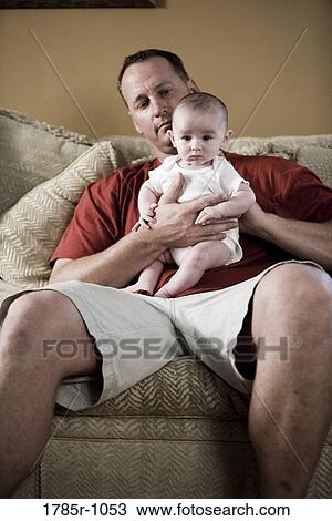 Father holding baby View Large Photo Image Stock Image - Father holding baby. Fotosearch