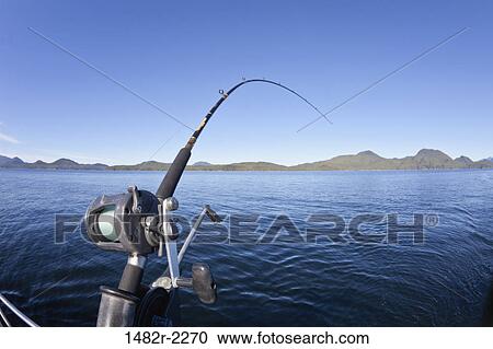 Fishing rod with mountain range in the background, British Columbia, Canada View Large Photo Image Stock Image - Fishing rod with mountain range in the background, British Columbia, Canada. Fotosearch