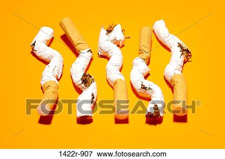 Five crushed cigarettes on orange background View Large Photo Image Stock Photo - Five crushed cigarettes on orange background. Fotosearch