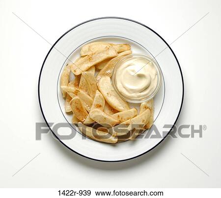 Stock Photo - Fried potatoes with mayonnaise on plate. Fotosearch