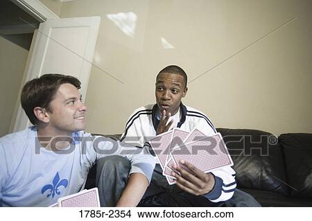 Friends playing cards at home View Large Photo Image Picture - Friends playing cards at home. Fotosearch