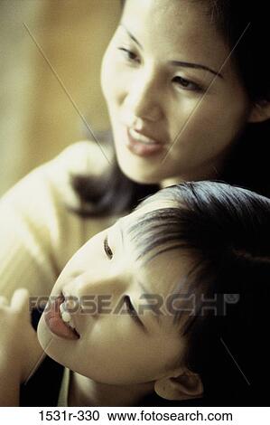 Stock Image - Girl with her mother. Fotosearch
