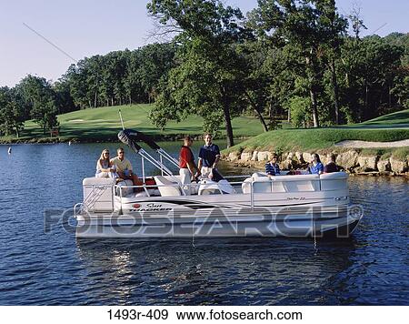 Group of people in a motorboat View Large Photo Image Stock Photo - Group of people in a motorboat. Fotosearch