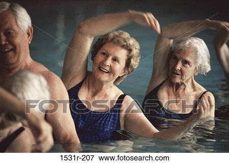 Stock Photo - Group of senior people in a swimming pool. Fotosearch