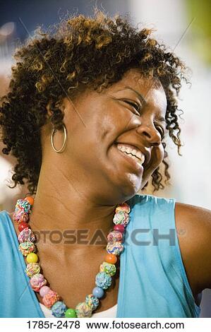 Headshot of young woman grinning View Large Photo Image Stock Photo - Headshot of young woman grinning. Fotosearch