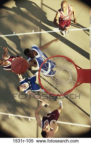 High angle view of men playing basketball View Large Photo Image Stock Photography - High angle view of men playing basketball. Fotosearch