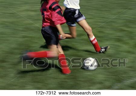 High angle view of two people playing soccer View Large Photo Image Stock Image - High angle view of two people playing soccer. Fotosearch