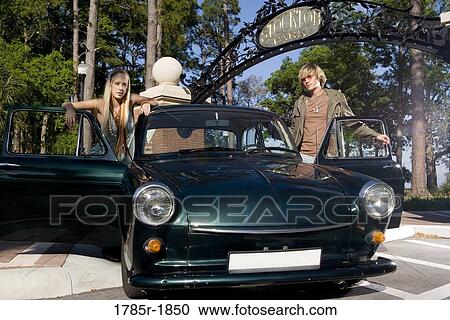 Stock Image - Hippie couple with car. Fotosearch