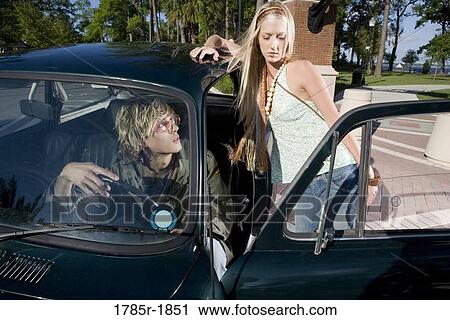 Hippie couple with car View Large Photo Image Stock Image - Hippie couple with car. Fotosearch