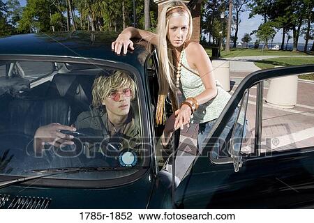 Hippie couple with car View Large Photo Image Stock Image - Hippie couple with car. Fotosearch