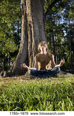 Stock Photo - Hippie meditating. Fotosearch