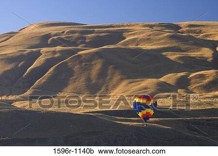Hot air balloon over a landscape, Horse Heaven Hills, The Great Prosser Balloon Rally, Prosser, Washington State, USA View Large Photo Image Stock Image - Hot air balloon over a landscape, Horse Heaven Hills, The Great Prosser Balloon Rally, Prosser, Washington State, USA. Fotosearch