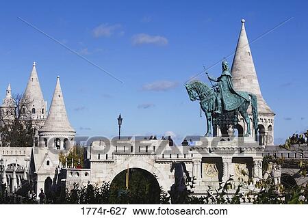 Stock Photo - Hungary, Budapest, Fishermen's Bastion with equestrian statue of St Stephens First King of Hungary. Fotosearch