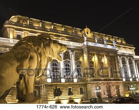 Stock Photograph - Hungary, Budapest, Lions Court of Buda Castle illuminated at night. Fotosearch