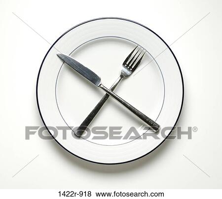 Knife and fork on plate View Large Photo Image Stock Photo - Knife and fork on plate. Fotosearch