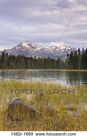 Stock Photo - Lake with mountains in the background, Scott Lake, Three Sisters, Willamette National Forest, Oregon, USA. Fotosearch