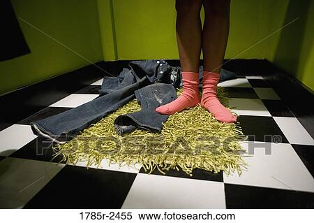 Stock Photography - Legs in dressing room. Fotosearch