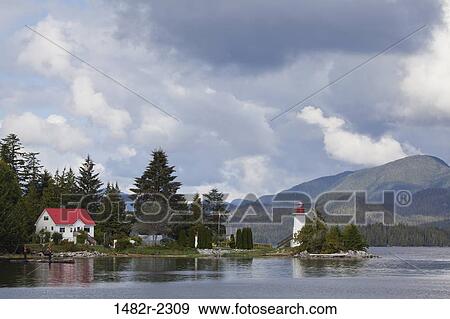 Stock Photo - Lighthouse on the coast, Dryad Point Lighthouse, Ivory Island, Bella Bella, British Columbia, Canada. Fotosearch