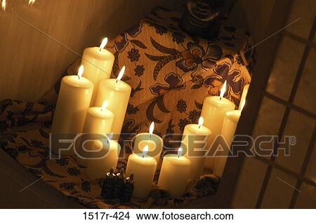 Lit candles View Large Photo Image Picture - Lit candles. Fotosearch