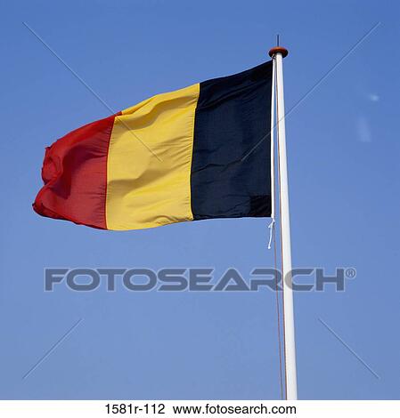 Stock Image - Low angle view of a Belgian flag. Fotosearch