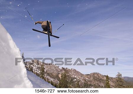 Low angle view of a skier jumping, Alpine Meadow, Lake Tahoe, California, USA View Large Photo Image Stock Photo - Low angle view of a skier jumping, Alpine Meadow, Lake Tahoe, California, USA. Fotosearch