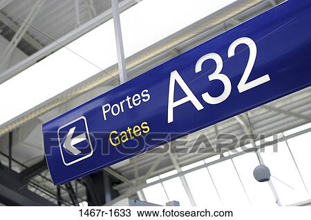 Low angle view of an overhead sign in an airport View Large Photo Image Stock Image - Low angle view of an overhead sign in an airport. Fotosearch