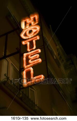 Stock Photography - Low angle view of hotel sign lit up at night, Istanbul, Turkey. Fotosearch