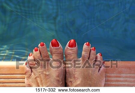 Stock Image - Low section view of a woman's feet. Fotosearch