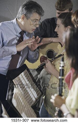 Male music teacher with students View Large Photo Image Stock Photo - Male music teacher with students. Fotosearch