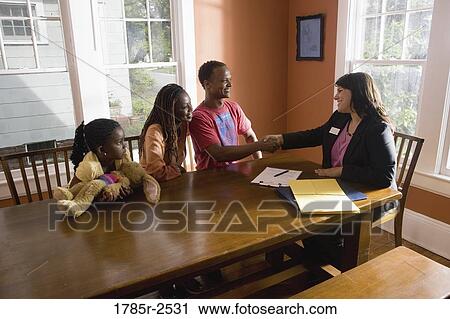 Man shaking hands with real estate broker View Large Photo Image Stock Image - Man shaking hands with real estate broker. Fotosearch