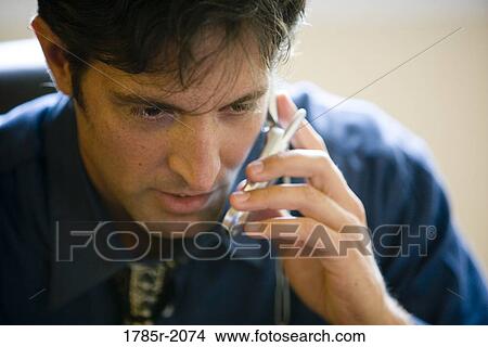 Man using cellphone View Large Photo Image Picture - Man using cellphone. Fotosearch
