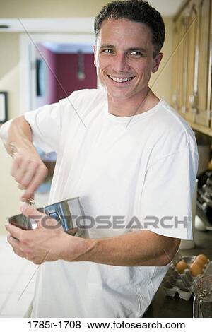 Man with mixing bowl View Large Photo Image Stock Photo - Man with mixing bowl. Fotosearch